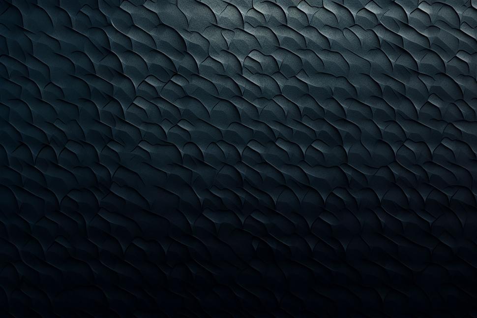 Free Image of A black surface with wavy lines 