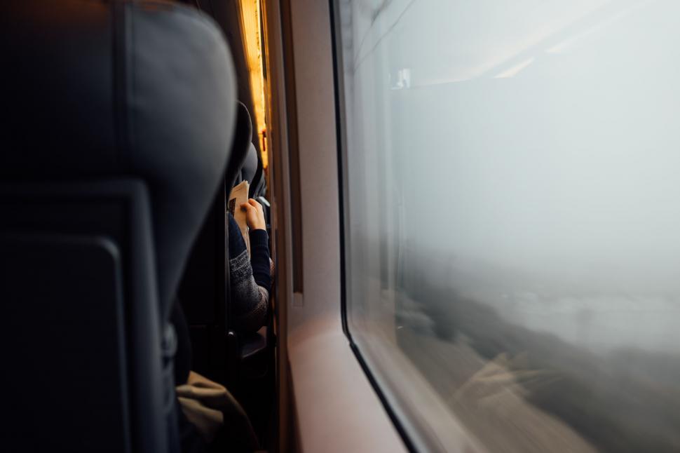 Free Image of A person sitting in a train 