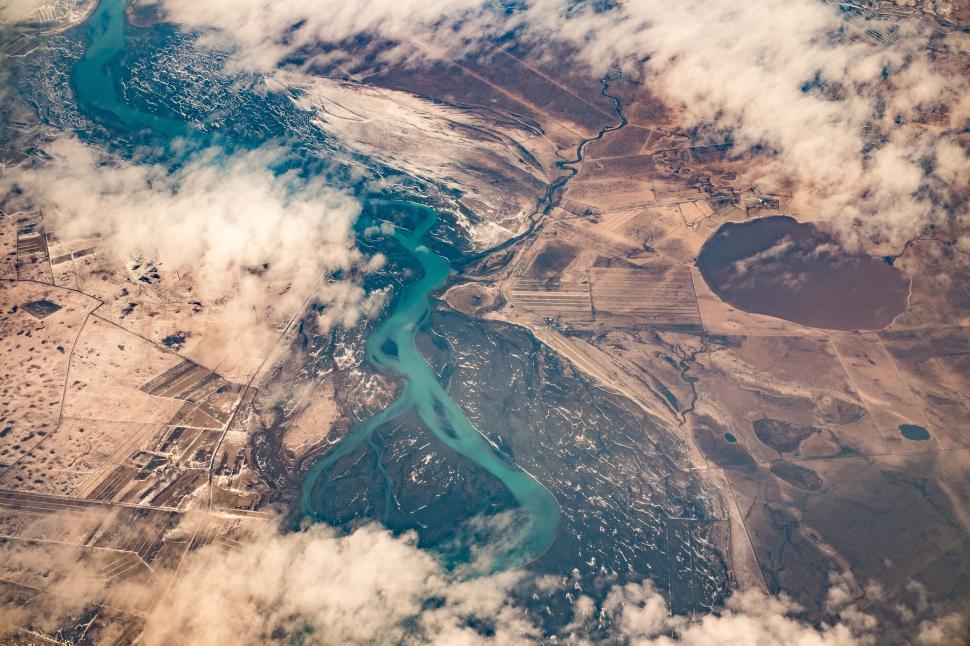 Free Image of Aerial view of a river and clouds 