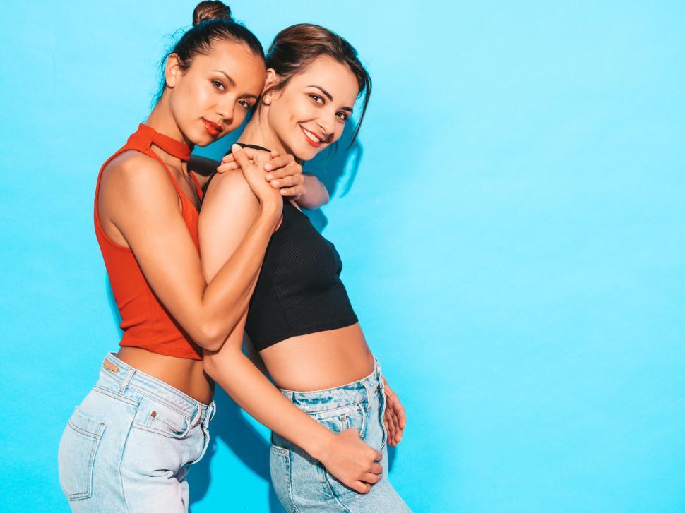 Free Image of Two women posing for a picture 