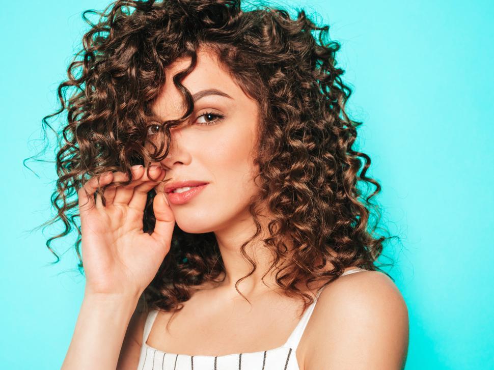 Free Image of A woman with curly hair 