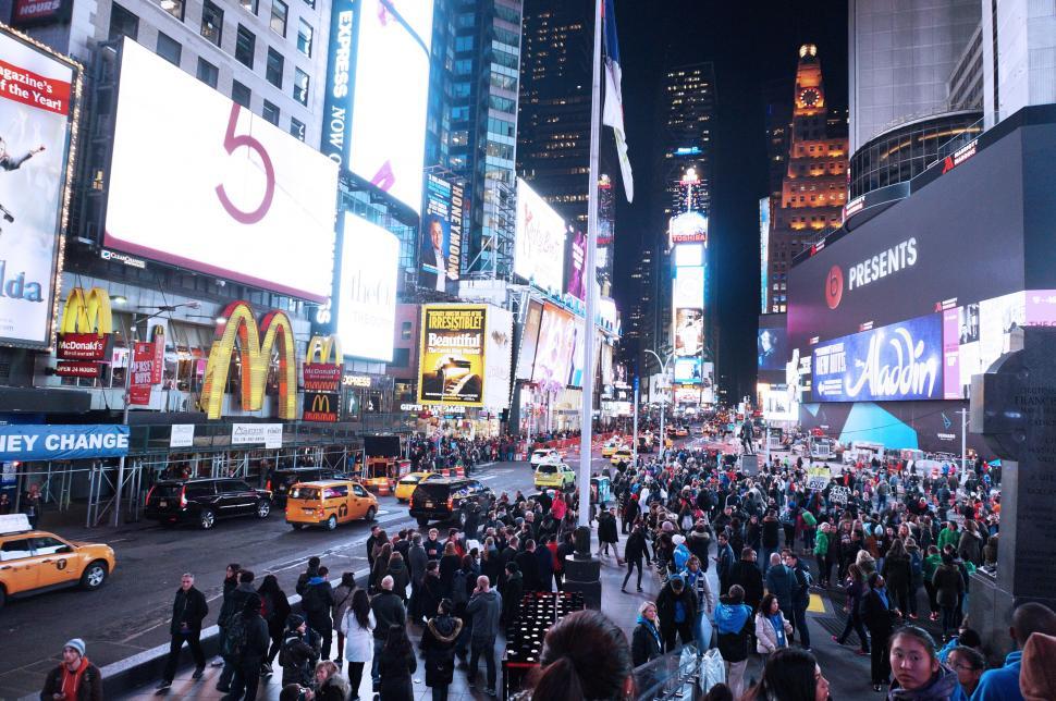 Free Image of A crowd of people in times square 