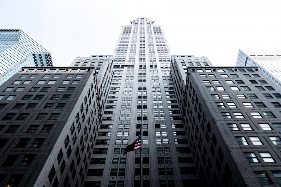 Free Image of A tall building with a flag 