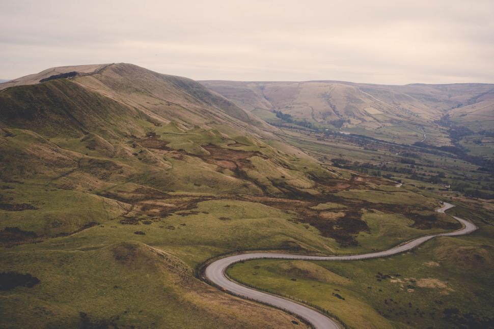 Free Image of A winding road through a valley 