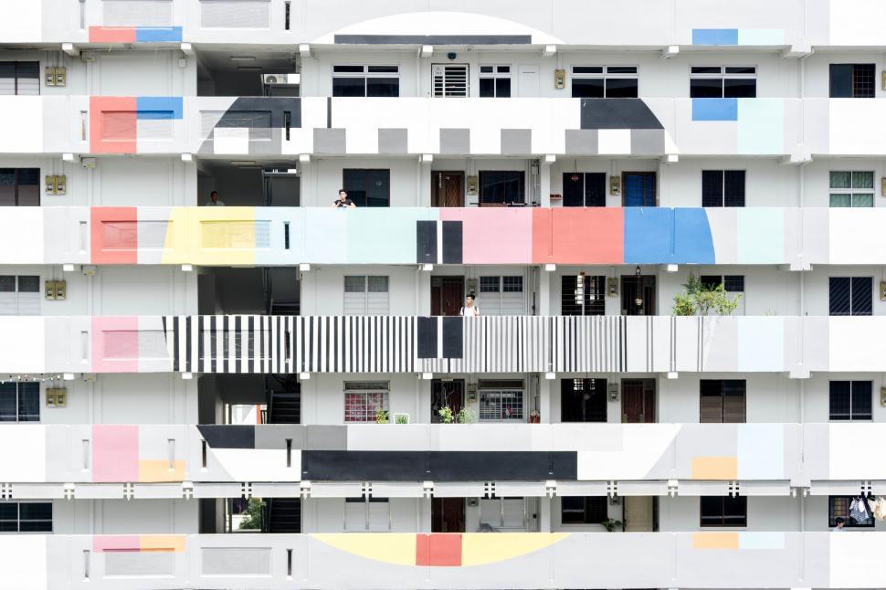 Free Image of A multi-story building with colorful balconies 