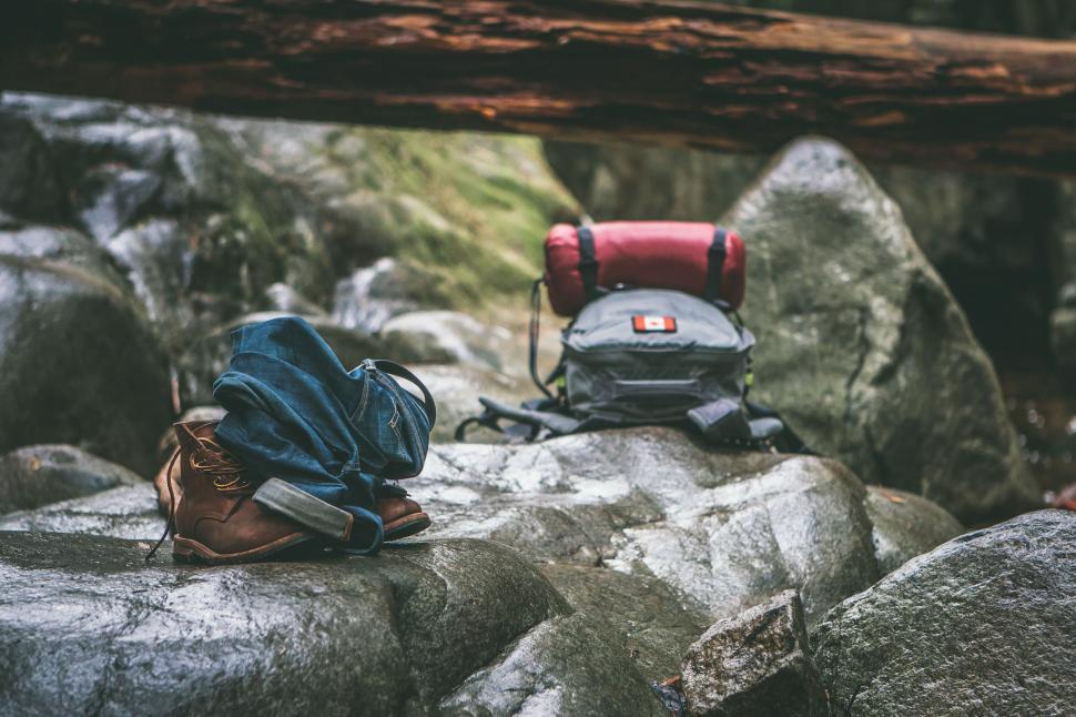 Free Image of A pair of backpacks on a rock 