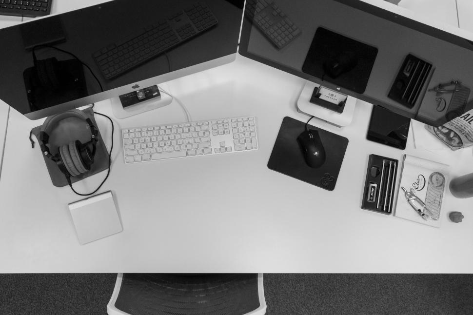 Free Image of A desk with computers and mouses 