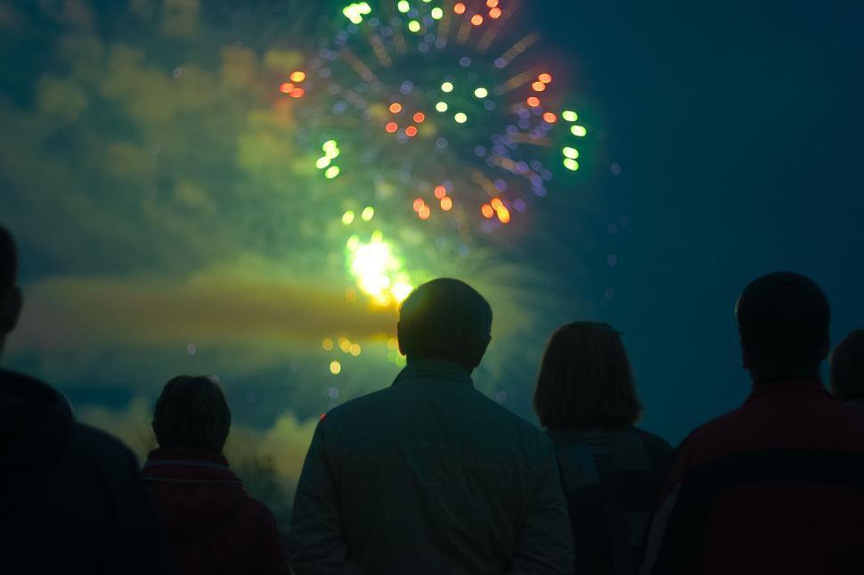 Free Image of A group of people looking at fireworks 