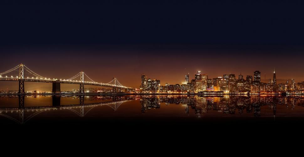 Free Image of A bridge over water with a city in the background 