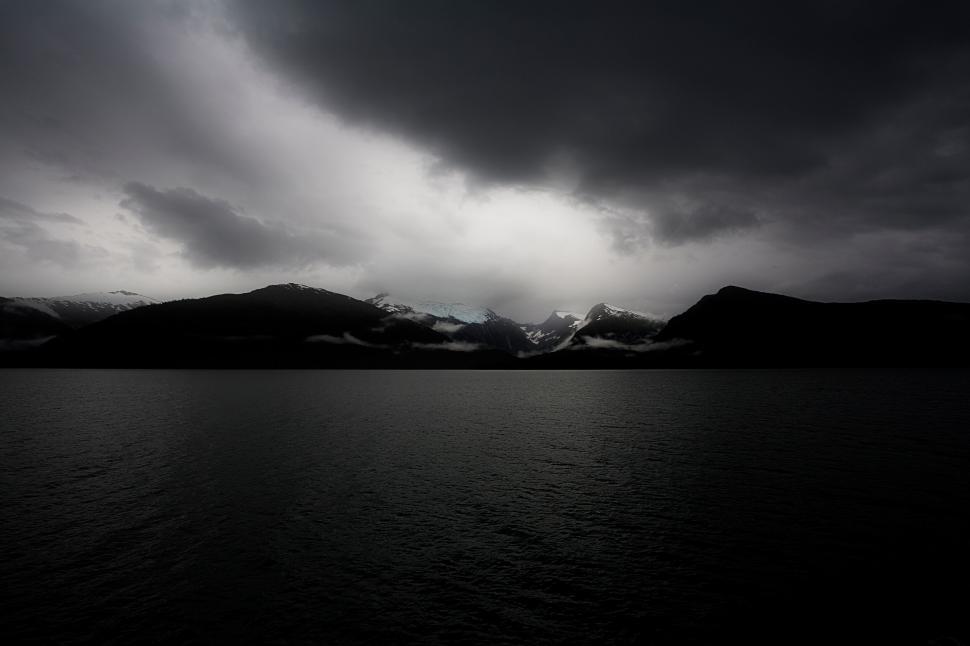 Free Image of A dark sky over a lake 