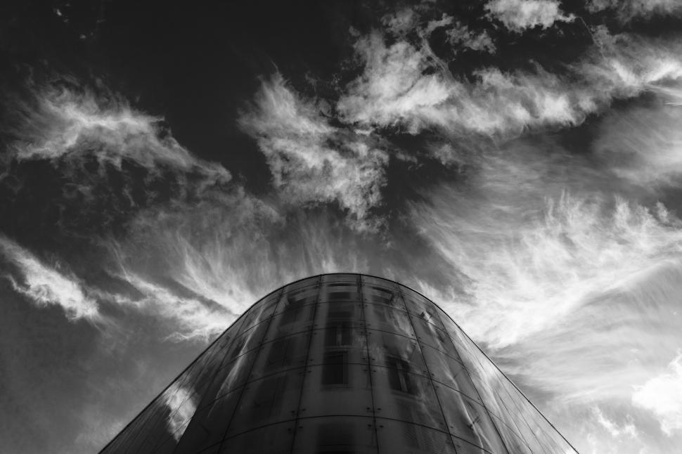 Free Image of A building with clouds in the sky 