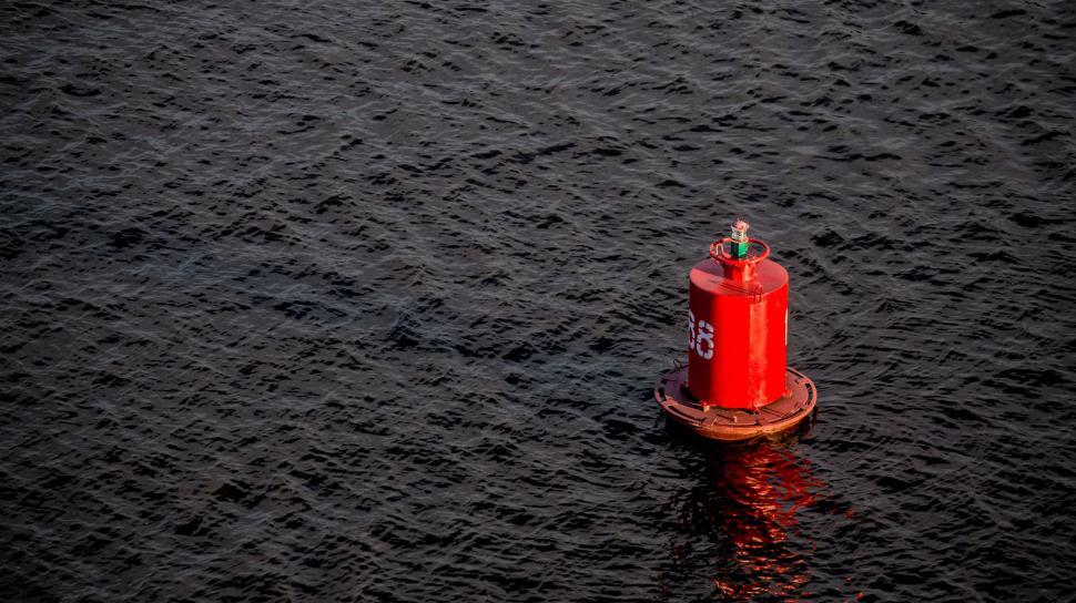 Free Image of A red buoy in the water 