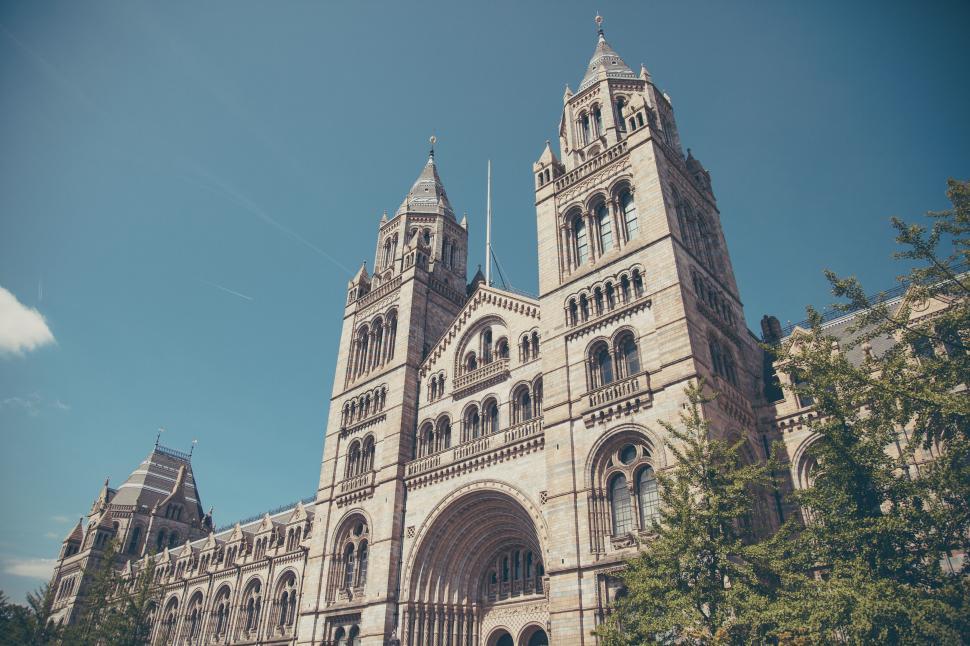 Free Image of A large stone building with towers with natural history museum in the background 