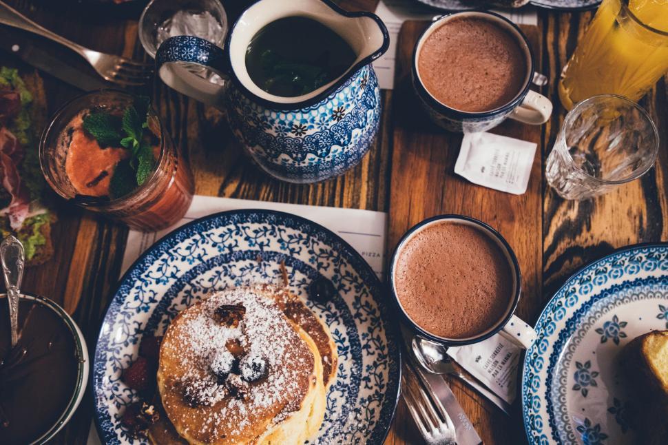 Free Image of A plate of pancakes and hot chocolate 
