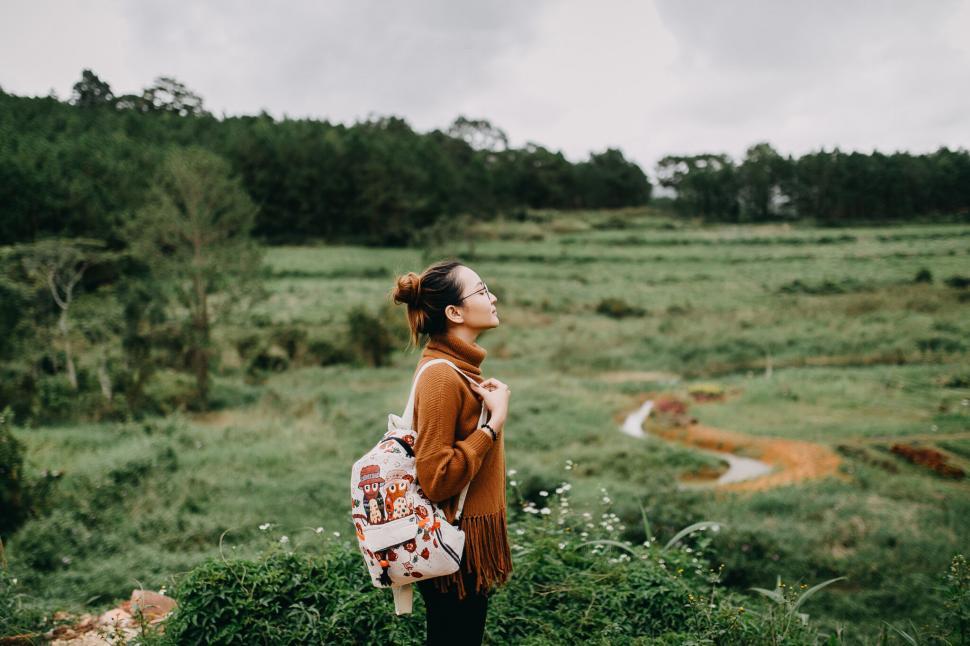 Free Image of A woman standing in a field 