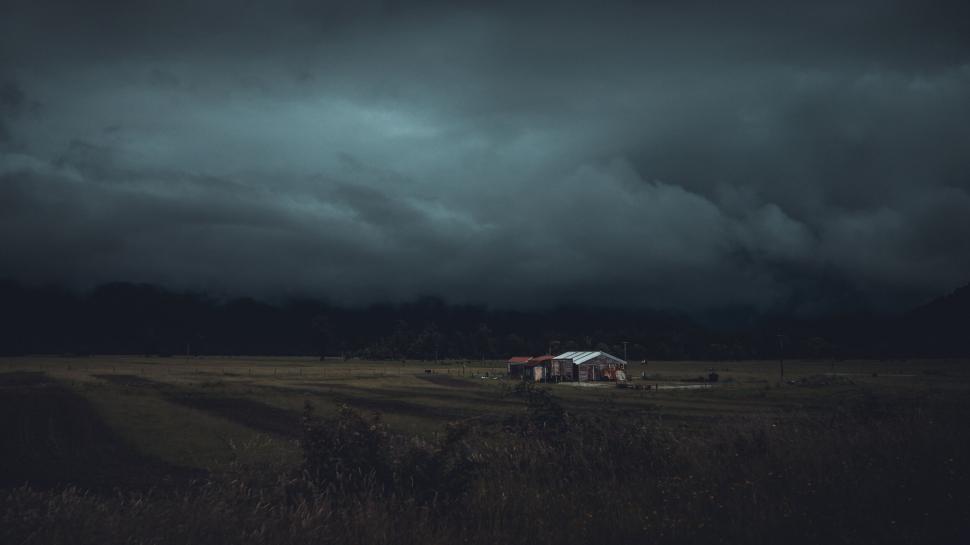 Free Image of dark house home green grass field clouds sky night alone 