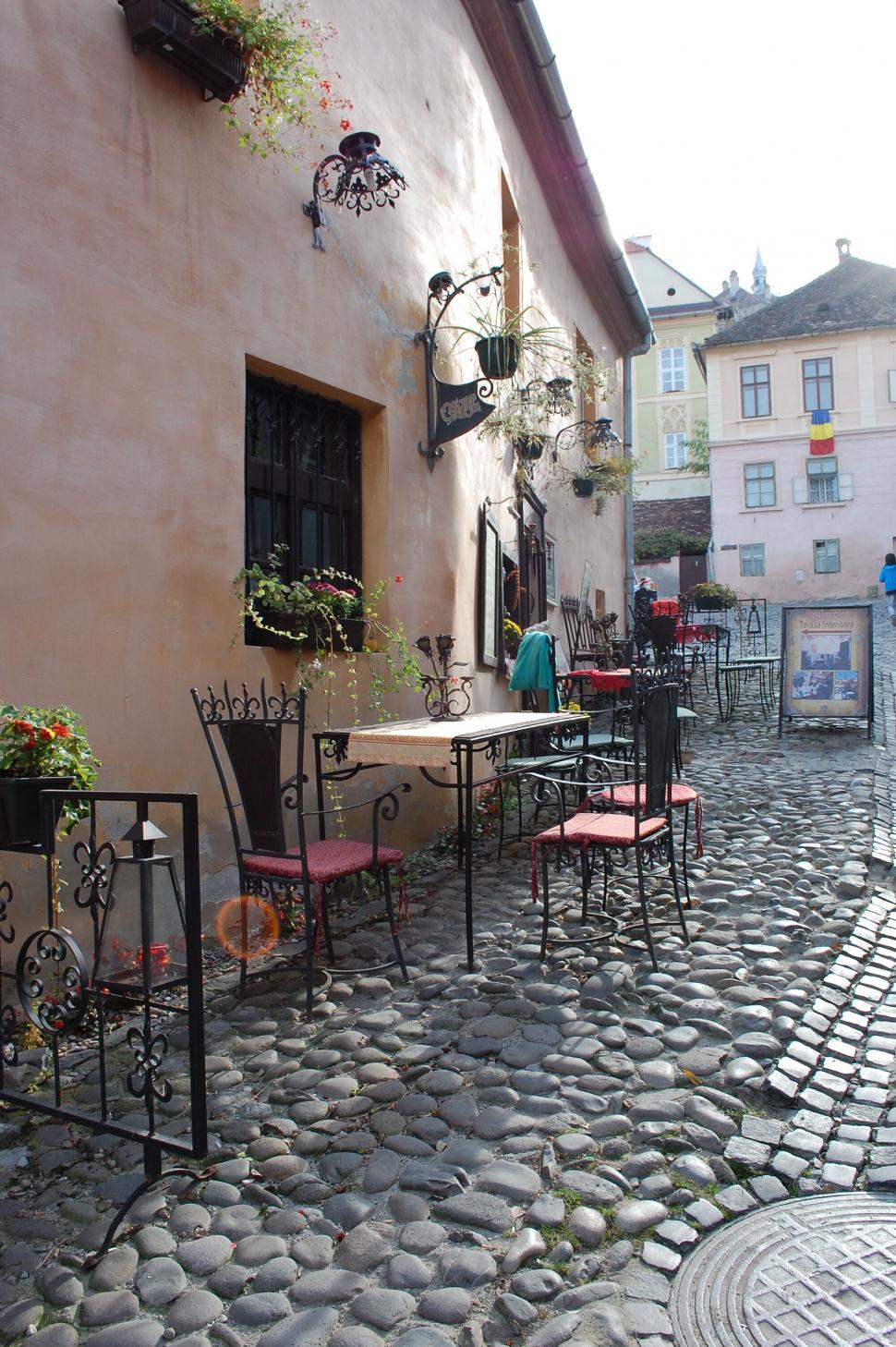 Free Image of A street with tables and chairs 