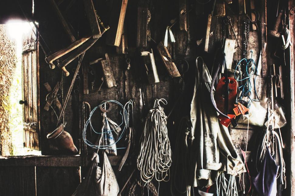 Free Image of A wall with tools and ropes 