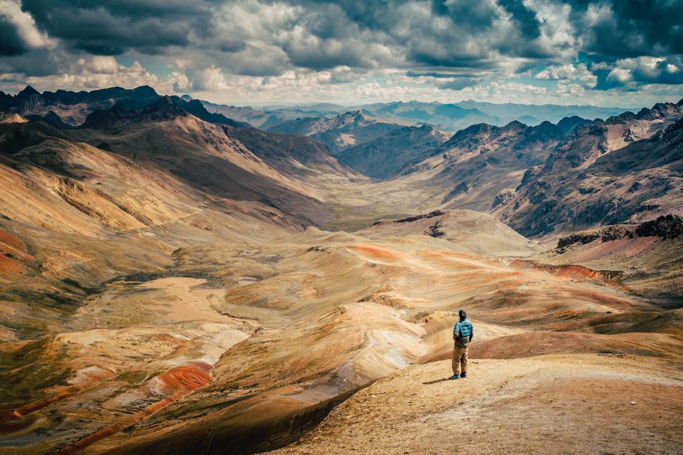 Free Image of A man standing on a mountain 