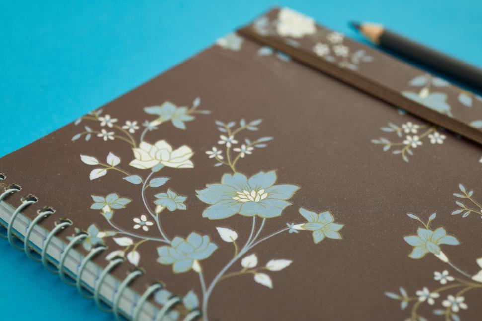 Free Image of A notebook with a pencil on it 