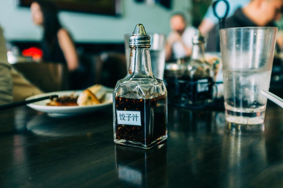 Free Image of A bottle of oil on a table 