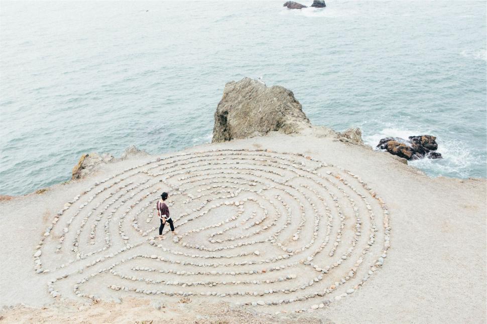 Free Image of A man walking in a labyrinth 