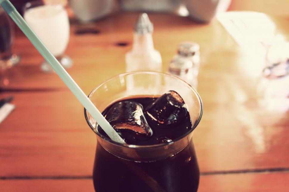 Free Image of A glass of liquid with ice and a straw 