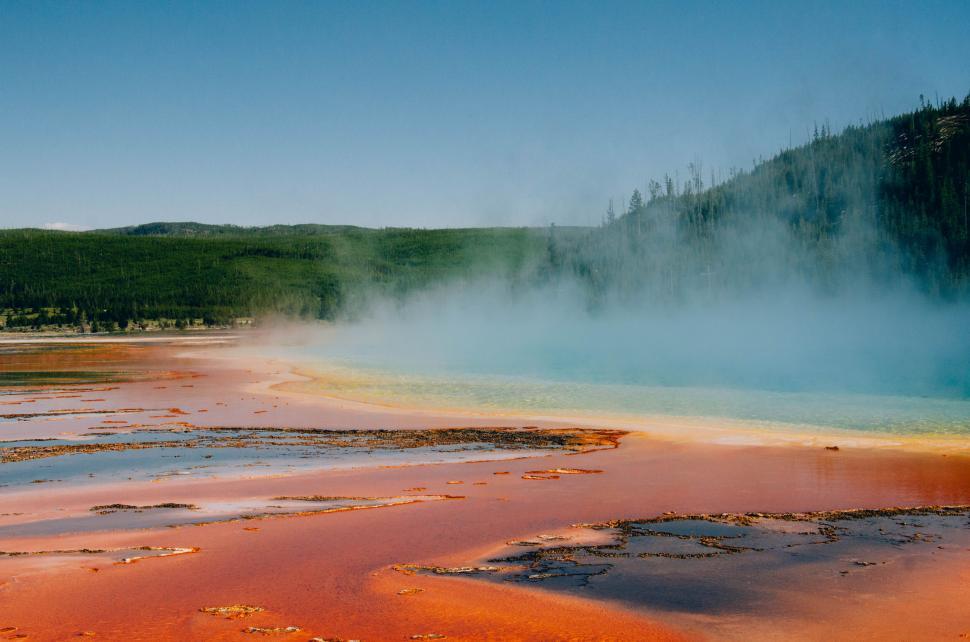 Free Image of A hot spring with red and orange water 