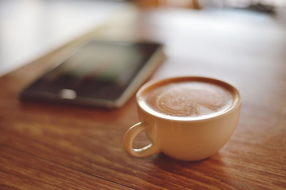Free Image of A cup of coffee on a table 