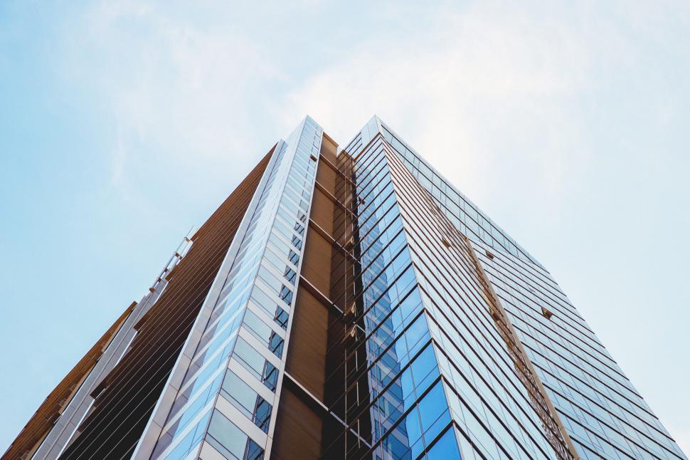 Free Image of A tall building with glass windows 