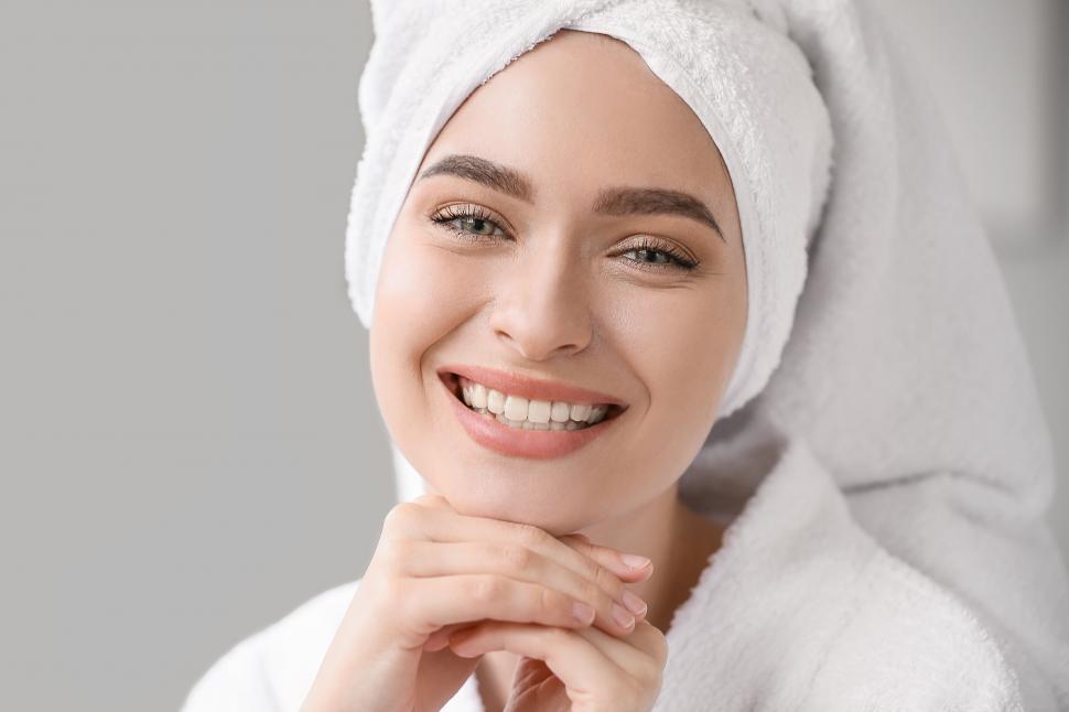 Free Image of A woman wearing a white towel on her head 