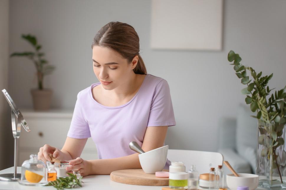 Free Image of A woman sitting at a table with a bowl of food 
