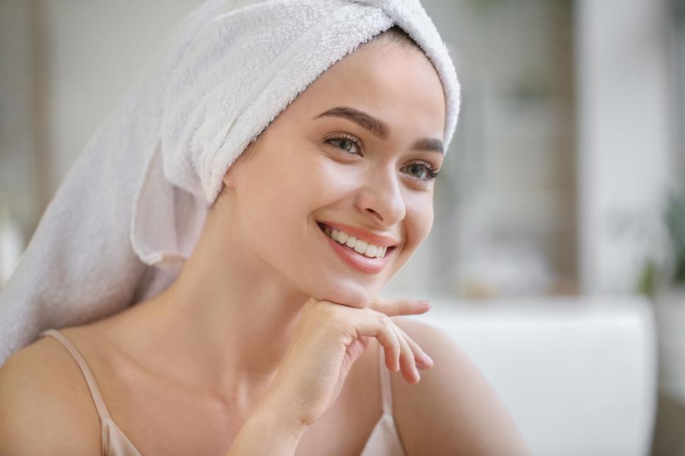Free Image of A woman with a towel on her head 