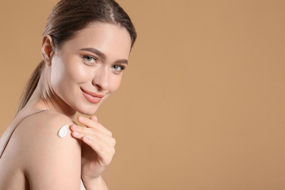 Free Image of A woman with a cream on her shoulder 