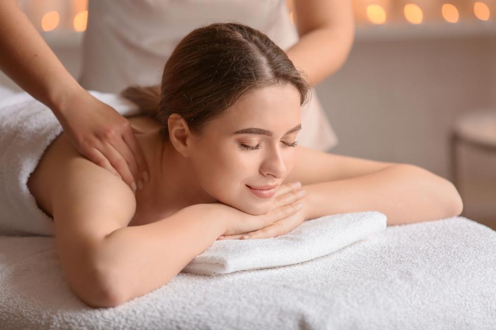 Free Image of A woman lying on a massage table 