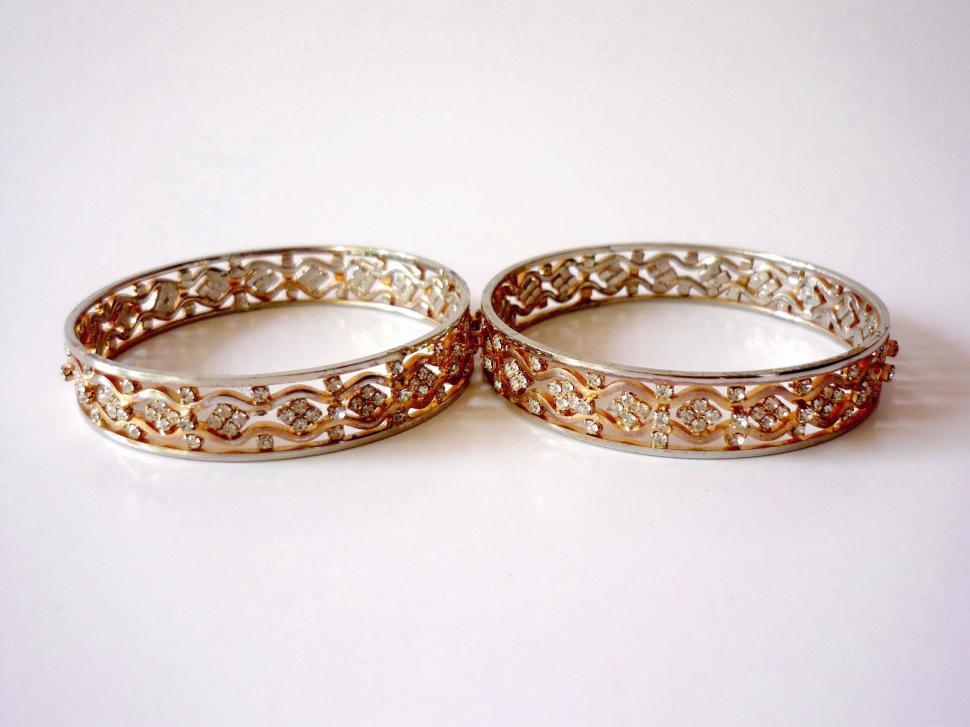Free Image of Elegant Gold and Diamond Wedding Rings 