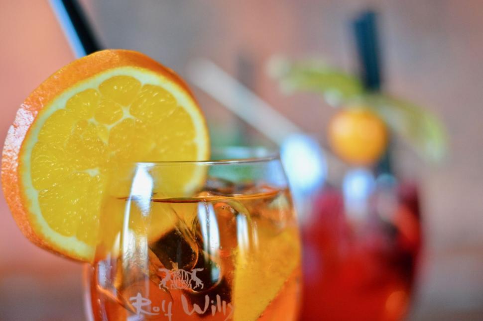 Free Image of A glass with a drink and a slice of orange 