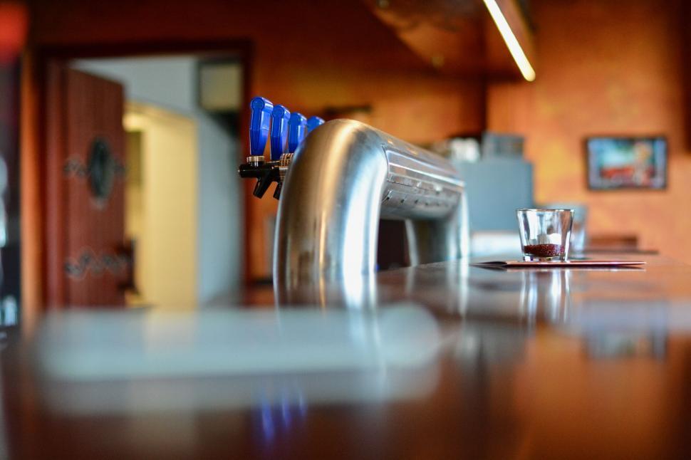 Free Image of A beer tap on a counter 