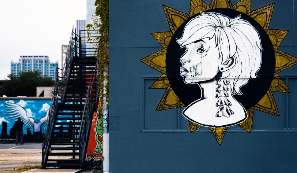 Free Image of A mural of a woman s face on a building 