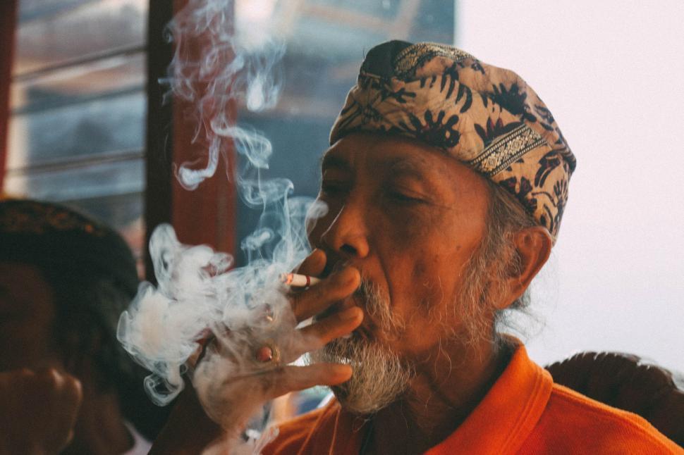 Free Image of Man With Turban Smoking a Cigarette 