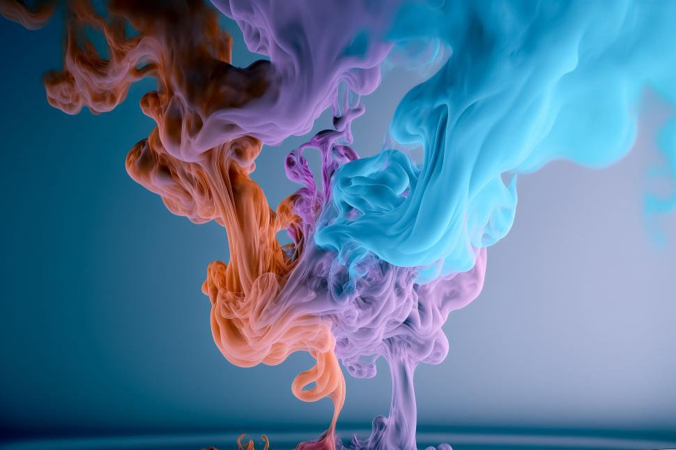 Free Image of Colorful smoke intertwining on dark background 
