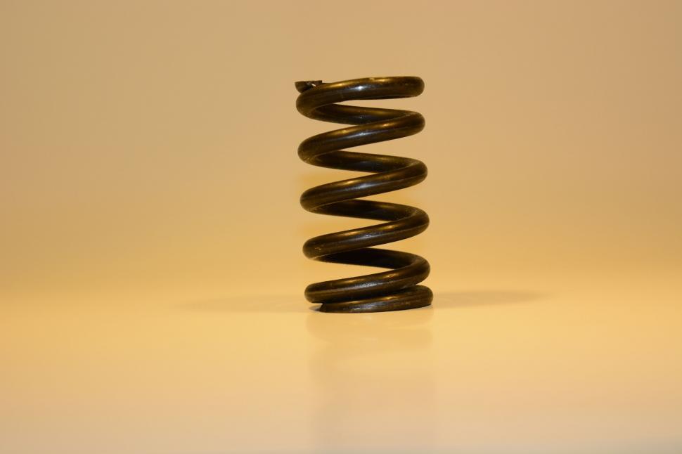 Free Image of Rusty metal coil on a neutral background 