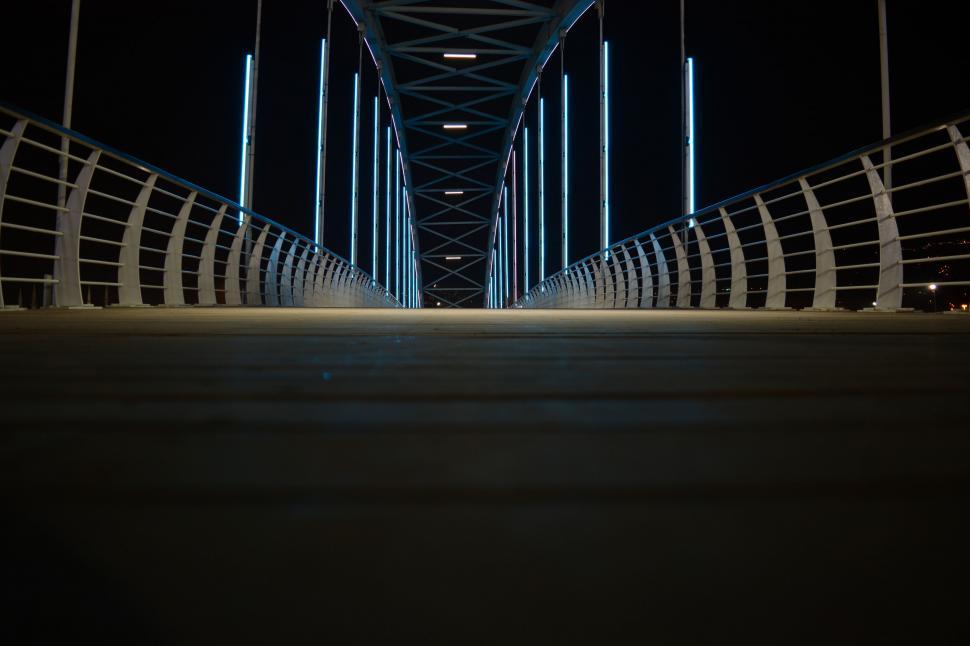 Free Image of Empty symmetrical bridge structure at night 