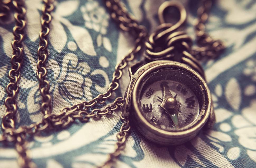 Free Image of Vintage compass necklace on fabric 