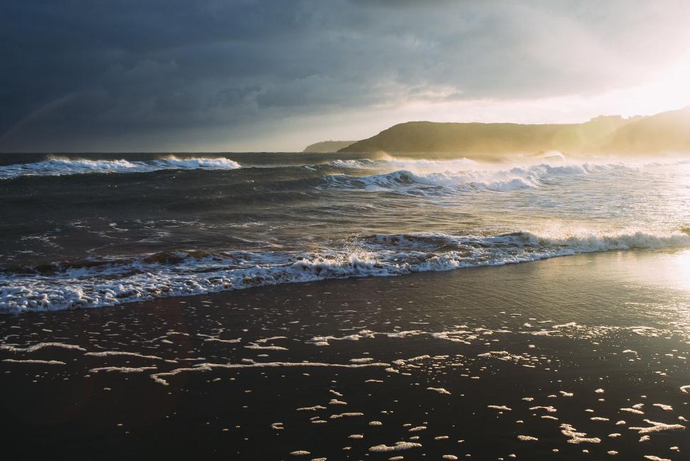 Free Image of Dynamic Beach Seascape at Golden Hour 