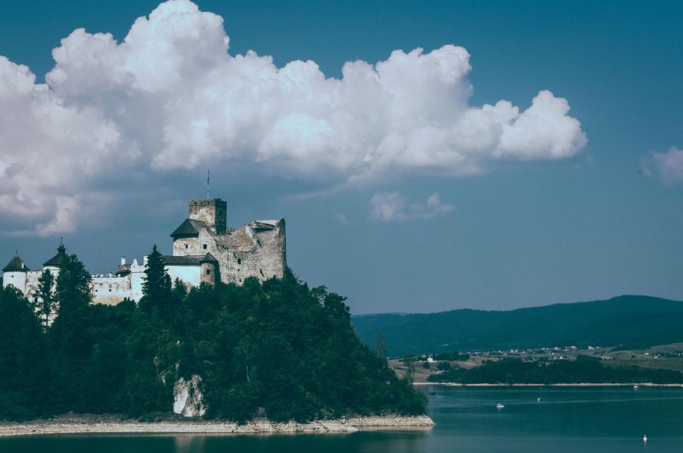 Free Image of Medieval castle overlooking a serene lake 