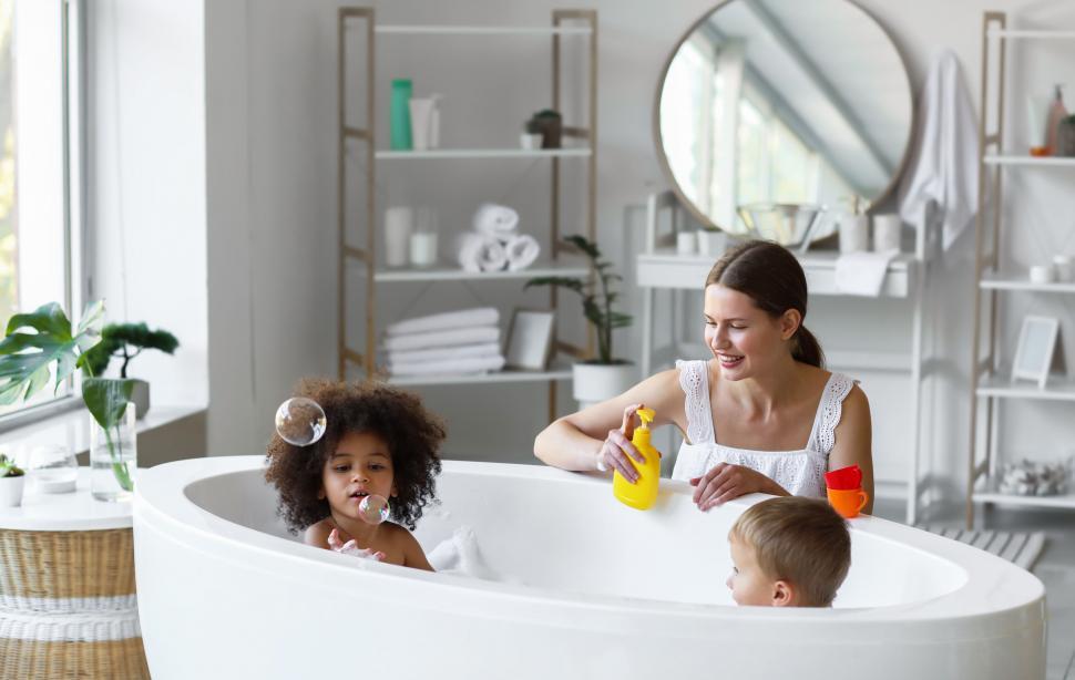 Free Image of Mother and children playing with bath foam 