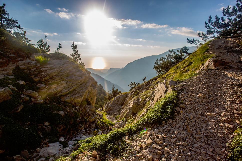 Free Image of Mountain trail during sunset with clear sky 