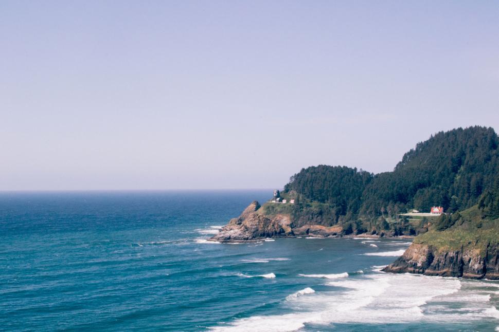 Free Image of Serene coastal landscape with lighthouse 