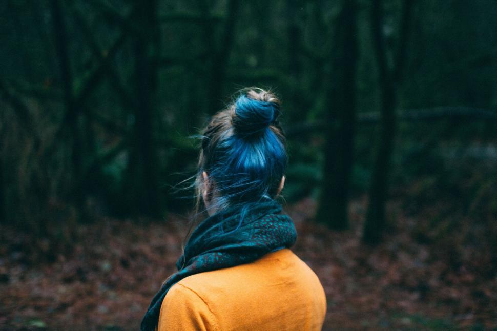 Free Image of Woman with blue hair in a forest setting 